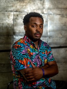 Headshot artist Vitus Shell in a retro 90’s shirt.